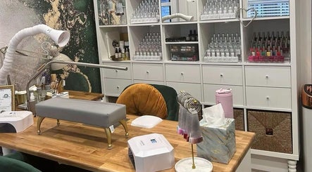 Elegant nail service desk at Pure Nails by Rachel, Newtown, Wales, GB with organized nail polish display.
