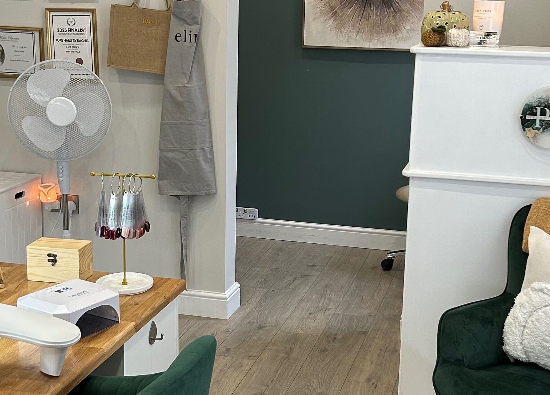 Cozy and elegant interior of Pure Nails by Rachel in Newtown, Wales, GB, featuring a nail station and decor.