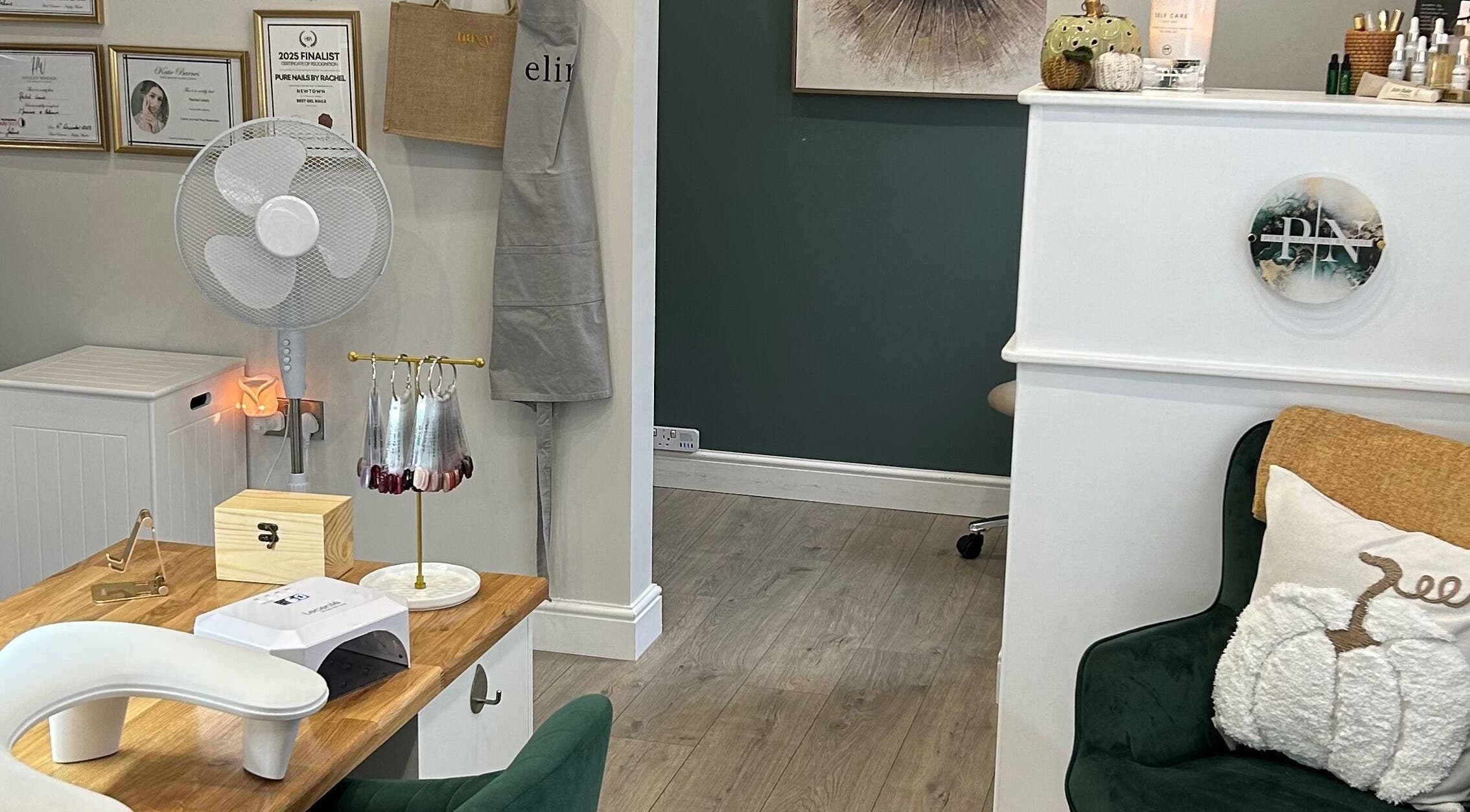 Cozy and elegant interior of Pure Nails by Rachel in Newtown, Wales, GB, featuring a nail station and decor.