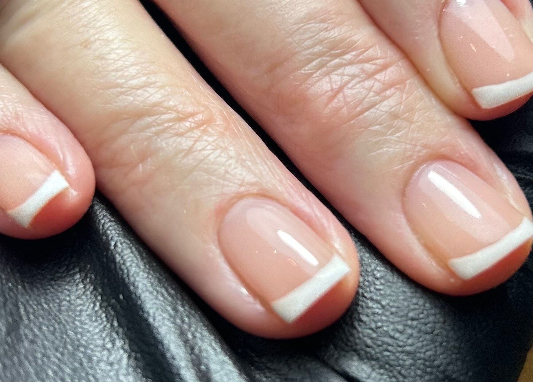 French manicure at Pure Nails by Rachel, Newtown, Wales, GB. Elegant, glossy nails with white tips.
