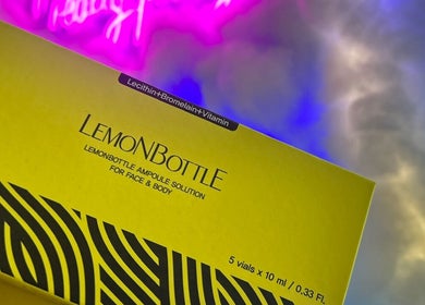 LemonBottle ampoule solution displayed at The Skin Dollhouse, Bradford, England, GB under vibrant lighting.