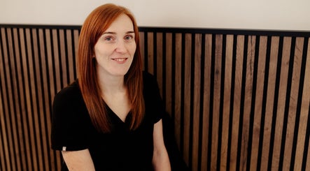 A team member smiling at Eivissa Wellbeing, Lancaster, England, GB.