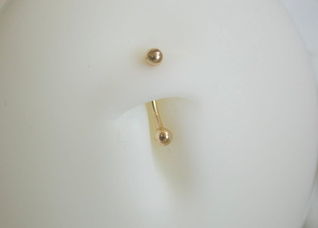 Bijou de piercing doré chez Eternità Luxury Piercing, Uccle, Bruxelles, BE. Design luxueux et raffiné.