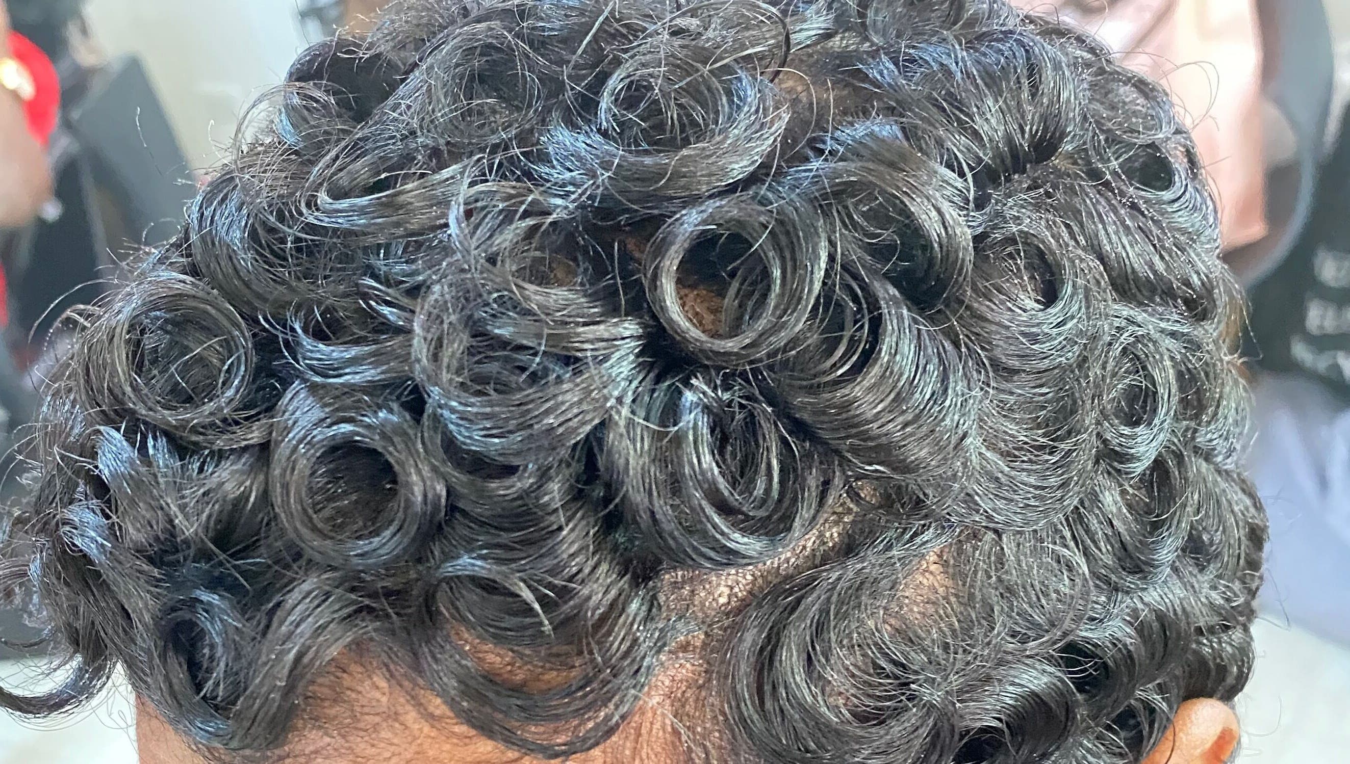 Close-up of stylish curls at Haus Of Lisa J, Bridgetown, Saint Michael, BB.