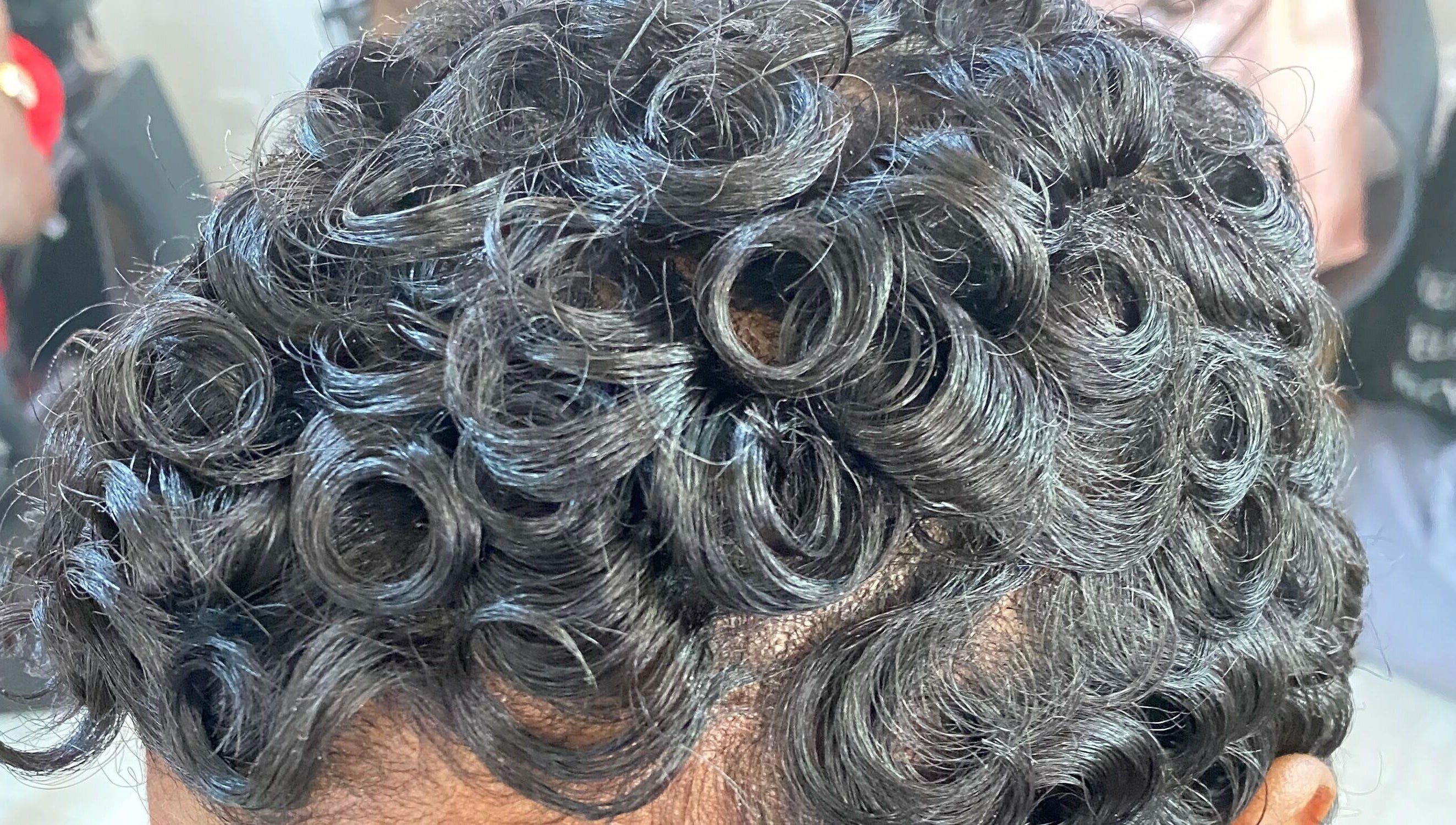 Close-up of stylish curls at Haus Of Lisa J, Bridgetown, Saint Michael, BB.