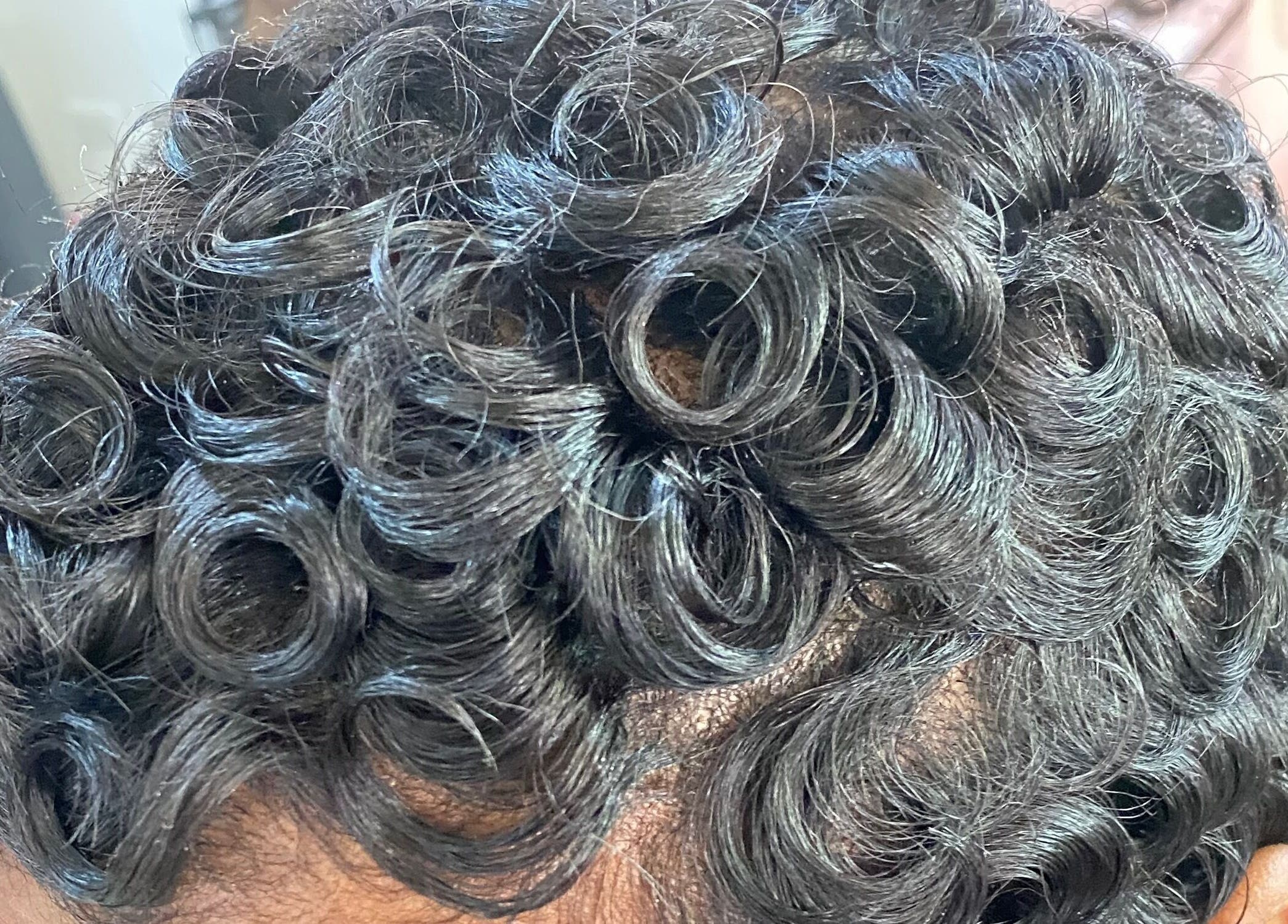 Close-up of stylish curls at Haus Of Lisa J, Bridgetown, Saint Michael, BB.