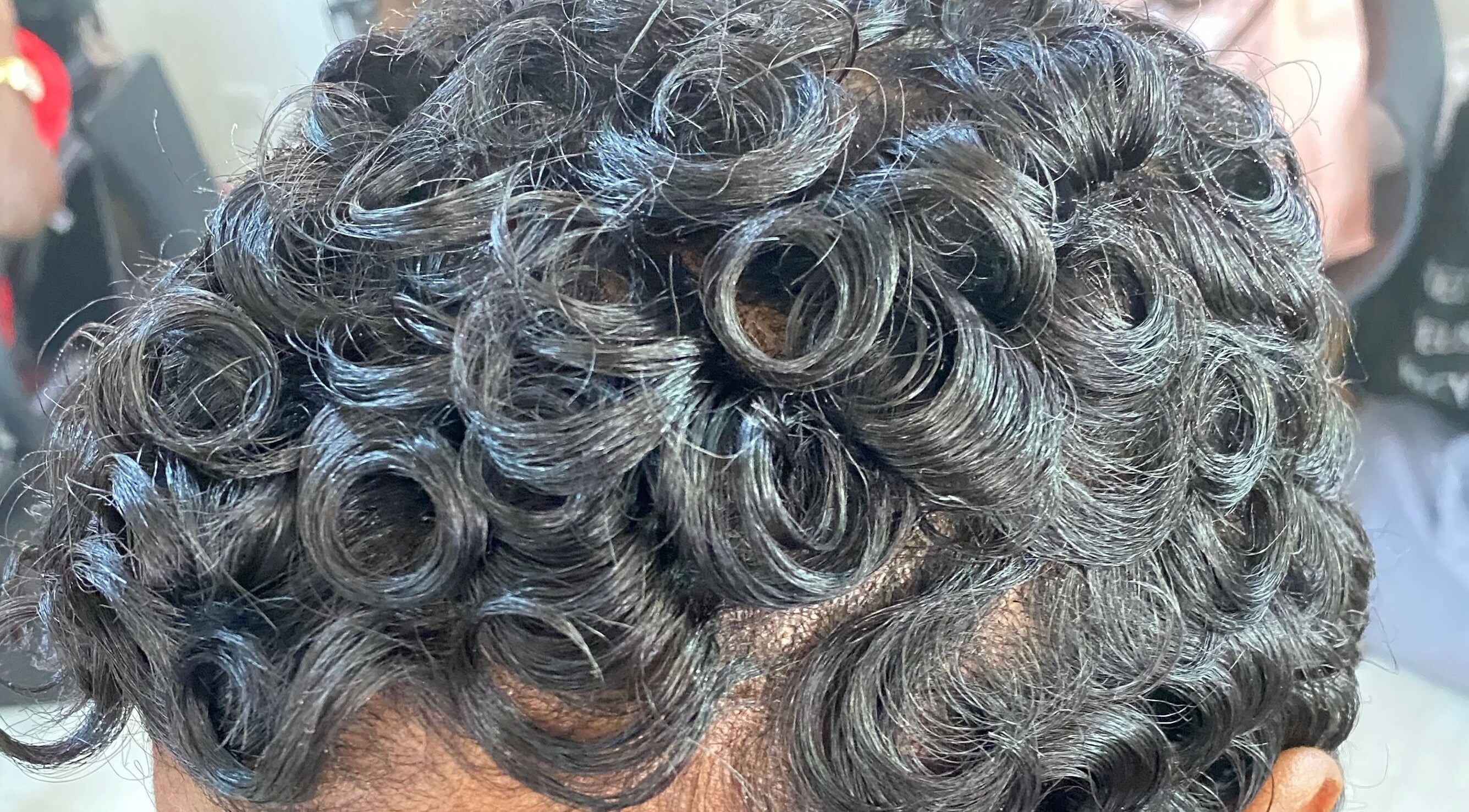 Close-up of stylish curls at Haus Of Lisa J, Bridgetown, Saint Michael, BB.