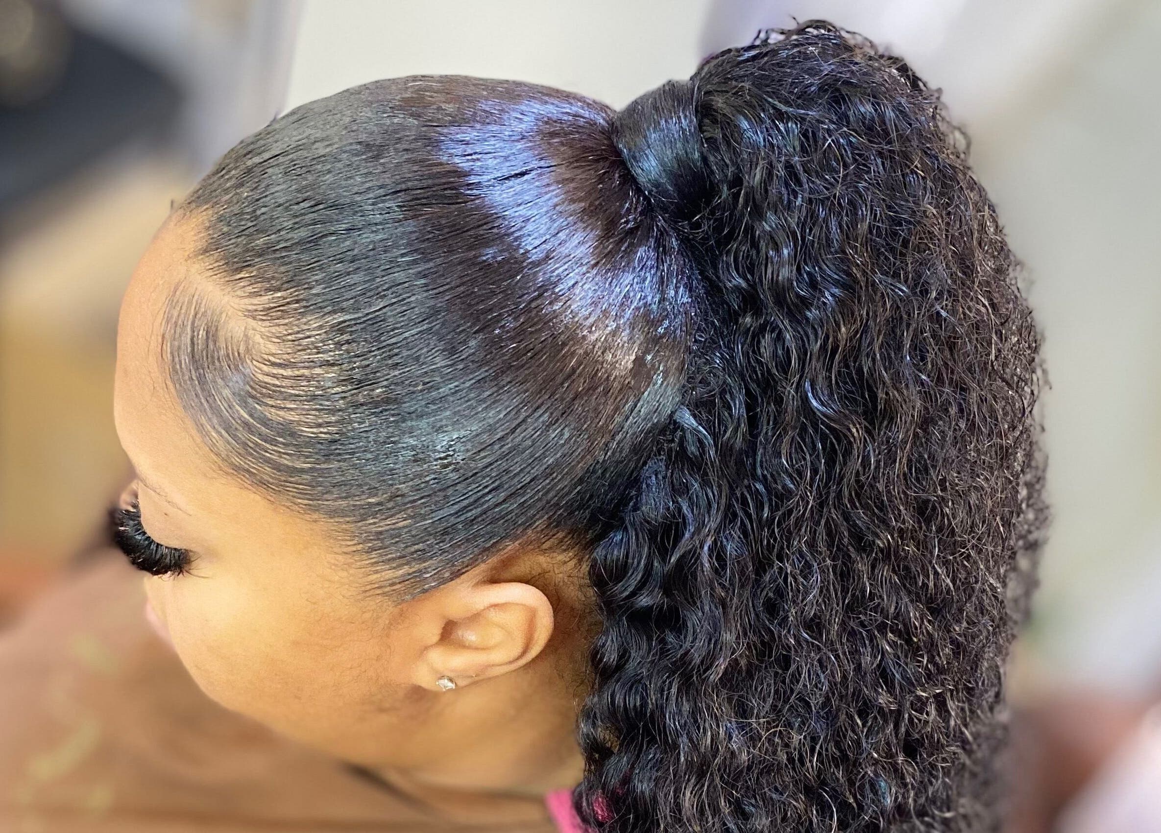 Elegant curly ponytail at Haus Of Lisa J, Bridgetown, Saint Michael, BB. Professional styling for a chic look.