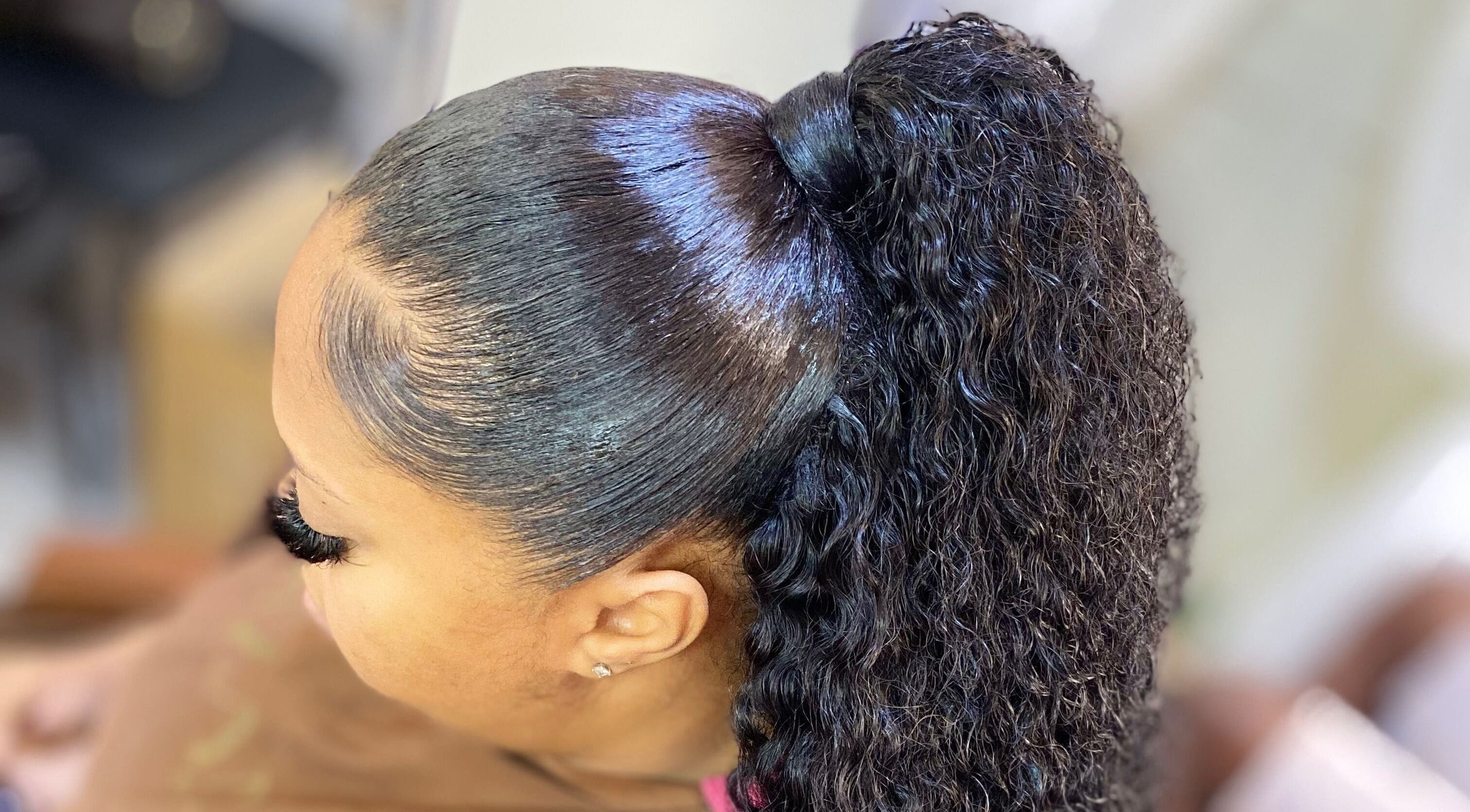 Elegant curly ponytail at Haus Of Lisa J, Bridgetown, Saint Michael, BB. Professional styling for a chic look.