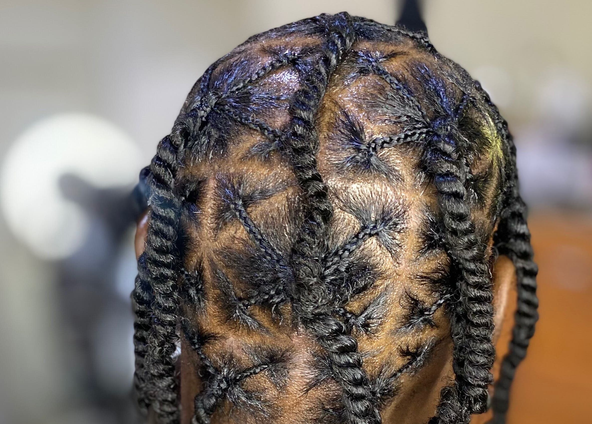Intricate braided hairstyle at Haus Of Lisa J, Bridgetown, Saint Michael, BB.
