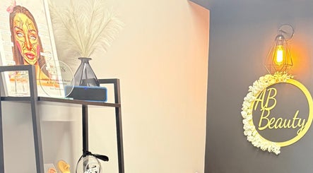 Chic interior of AB Beauty & Hair Extensions in Newton Abbot, England, GB with stylish decor and glowing sign.