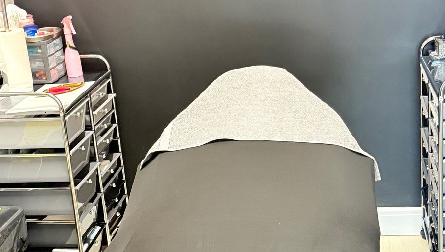 Relaxing treatment bed at AB Beauty, Newton Abbot, England, GB, surrounded by professional spa supplies.