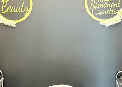 Inside AB Beauty, Newton Abbot, England, showcasing sleek decor and cosmetics setup.