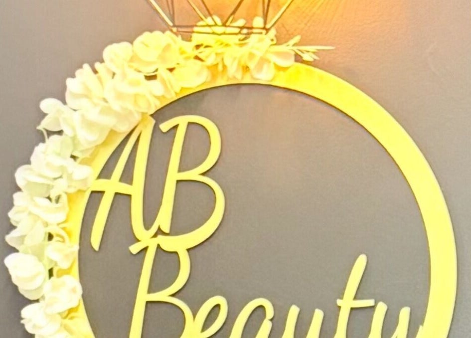 Elegant AB Beauty logo with floral design in Newton Abbot, England, GB, exuding elegance and charm.