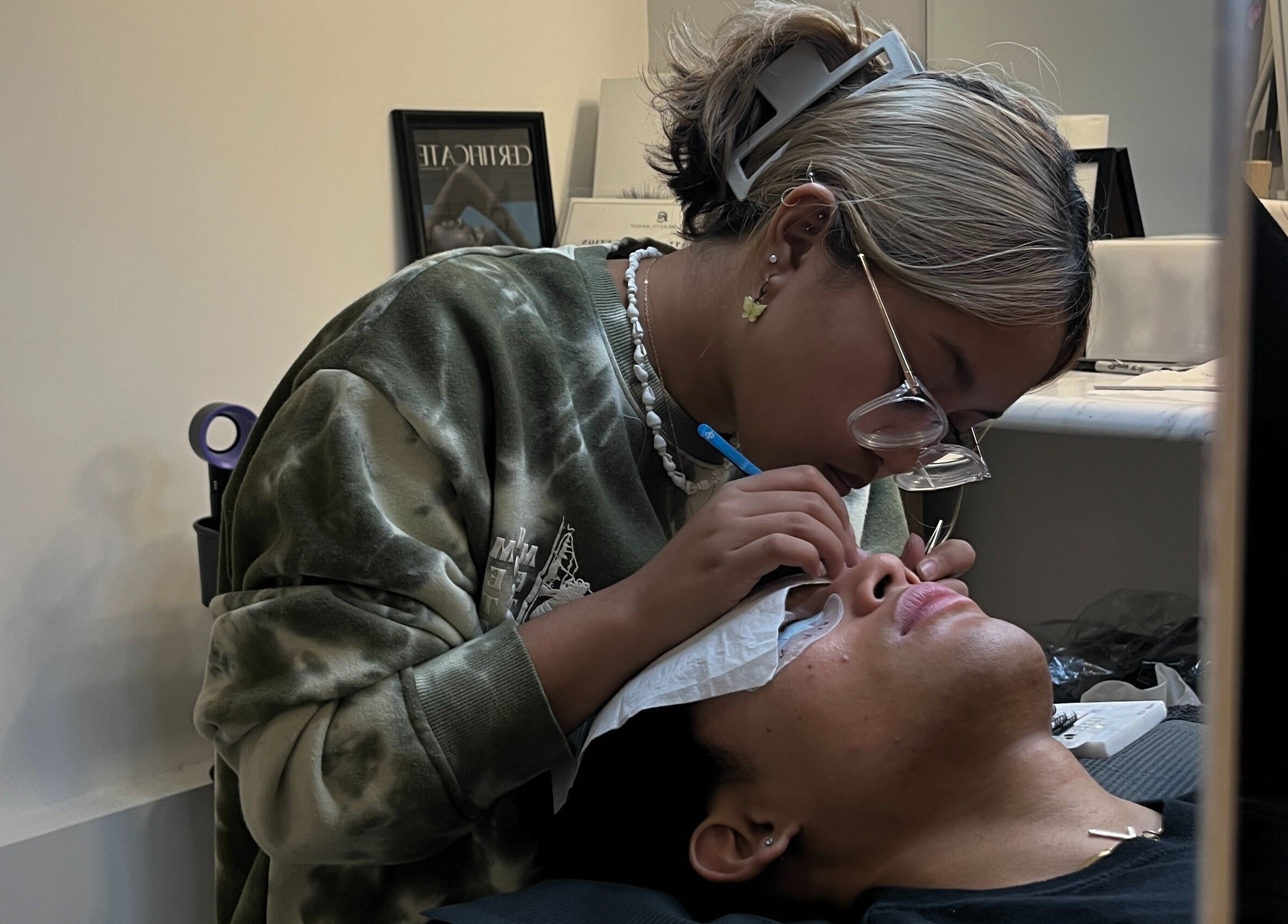 Technician performing eyelash extension at Enokieyes, Delta, British Columbia, CA.