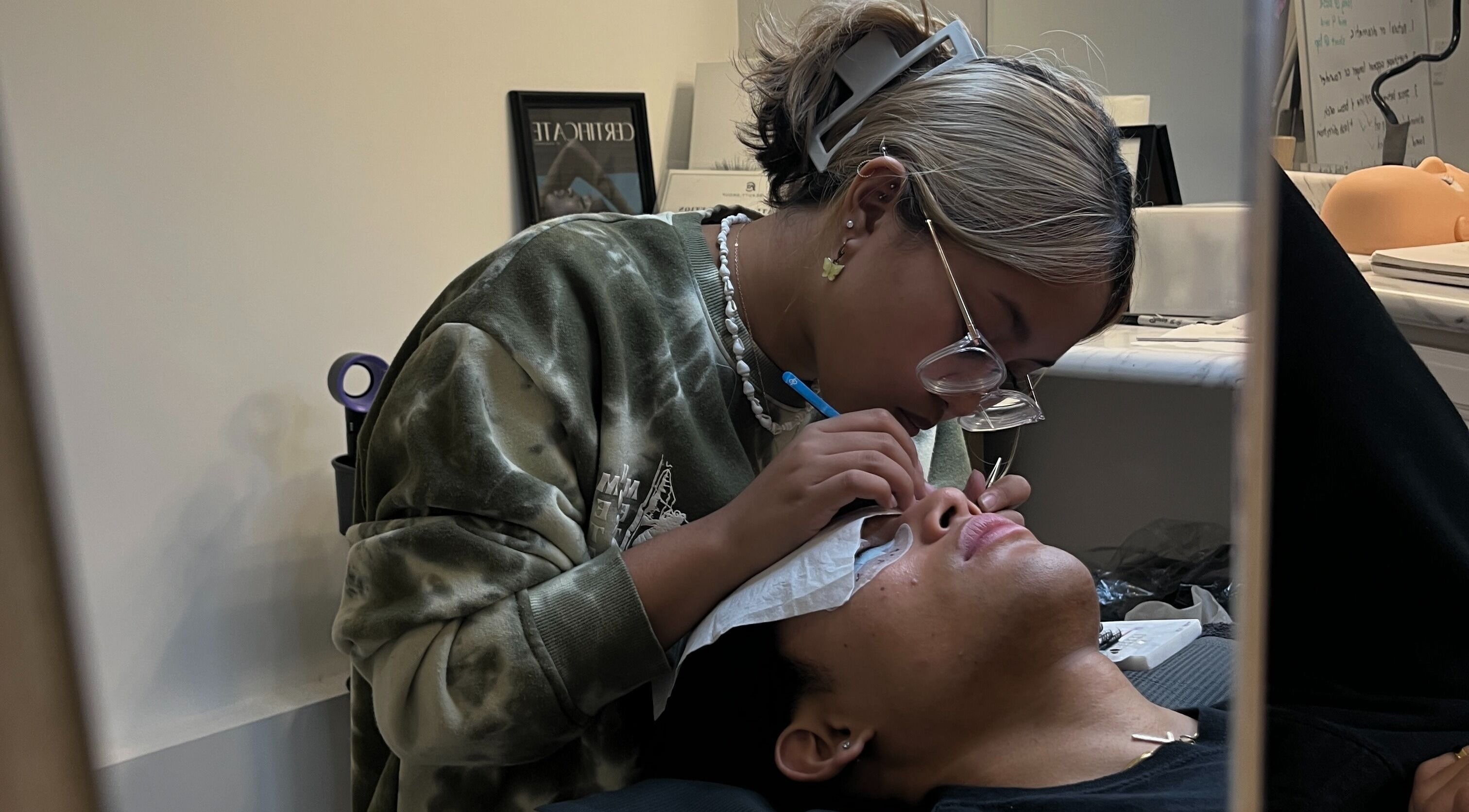Technician performing eyelash extension at Enokieyes, Delta, British Columbia, CA.