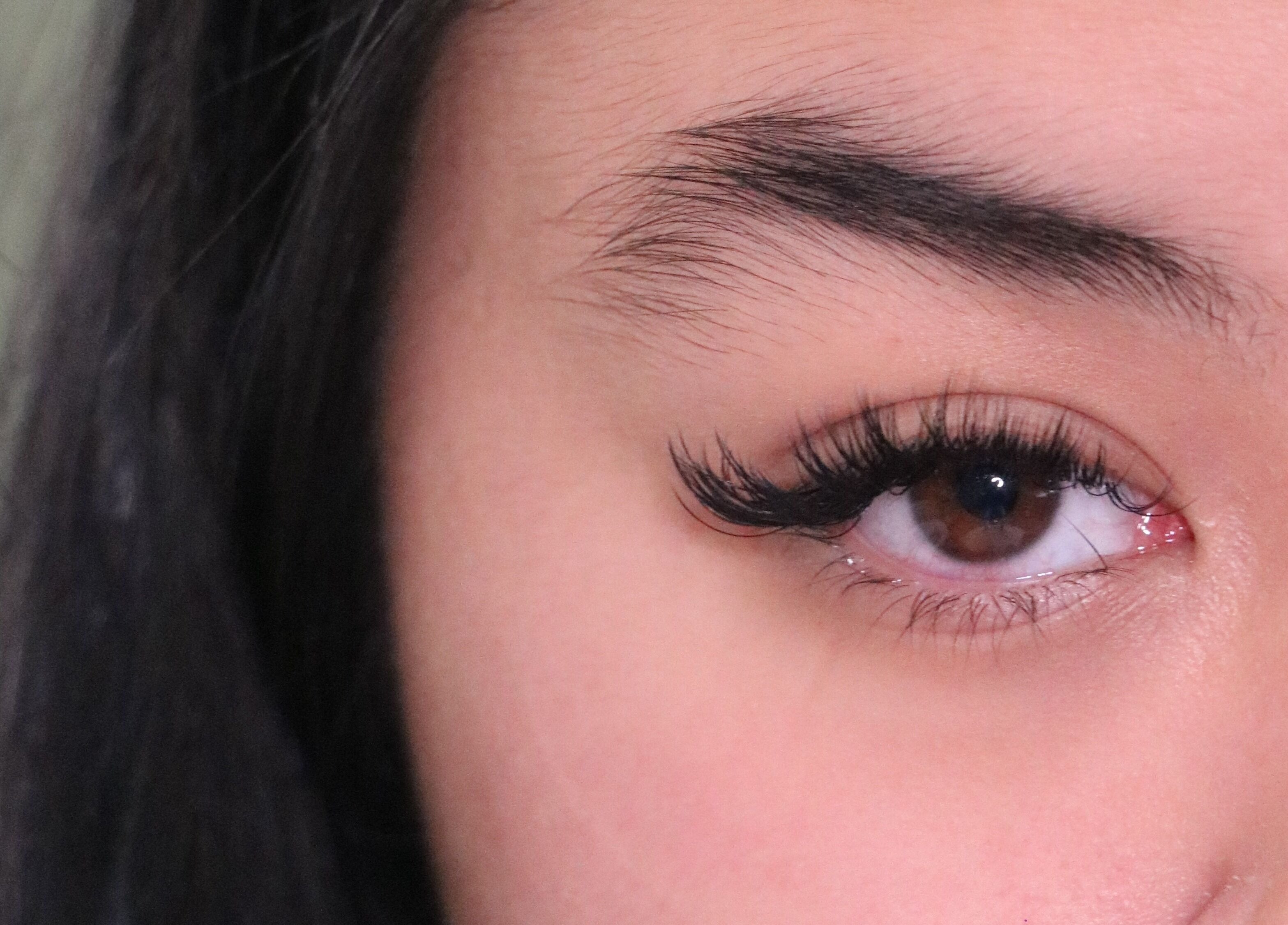 Close-up of eye with luxurious lashes at Enokieyes, Delta, British Columbia, CA enhancing beauty.