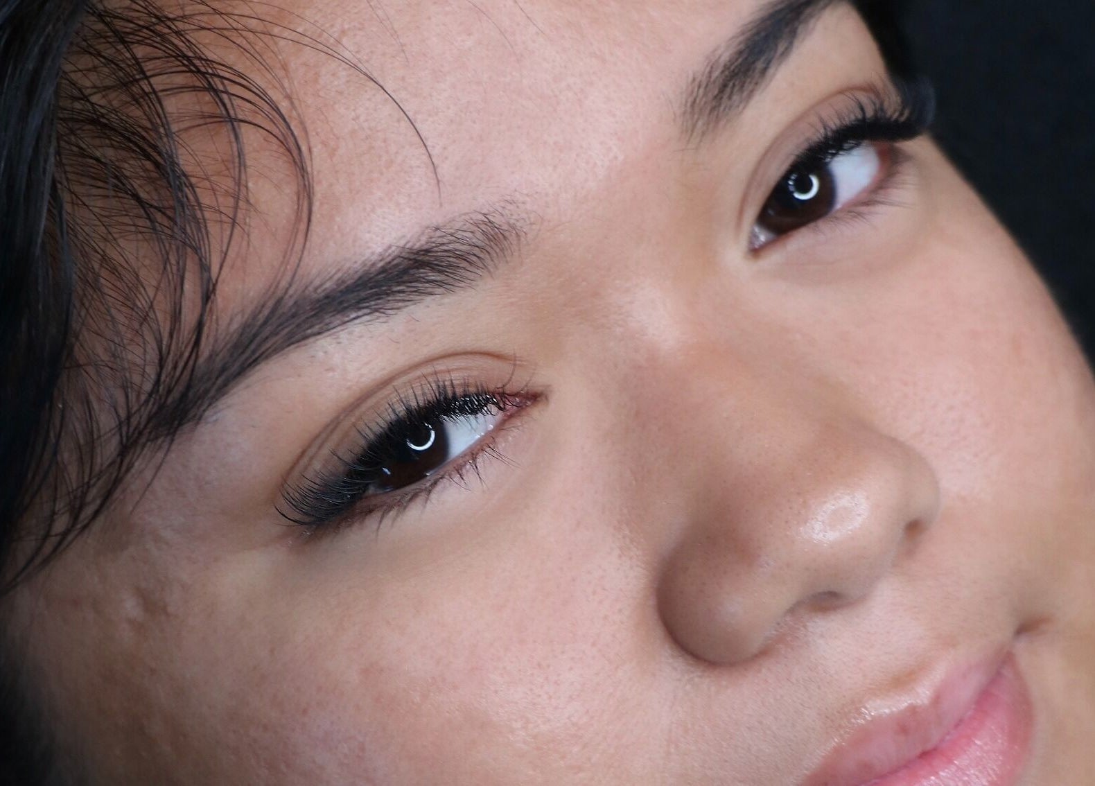 Close-up of expertly done eyelashes at Enokieyes in Delta, British Columbia, CA showcasing natural beauty.