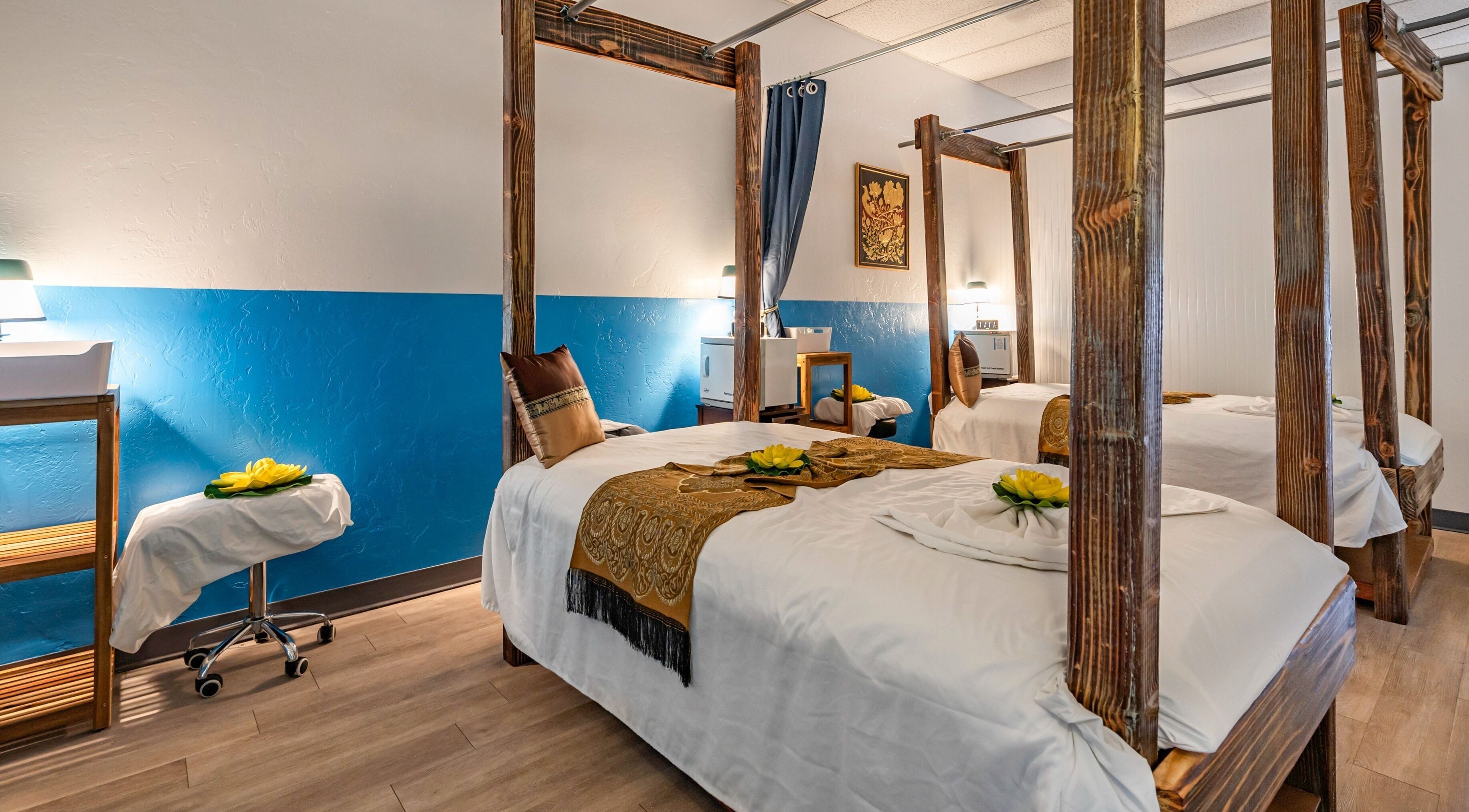 Elegant massage room at Ma Thai Massage (Thornydale) in Tucson, Arizona, US with decorated beds and calming ambiance.