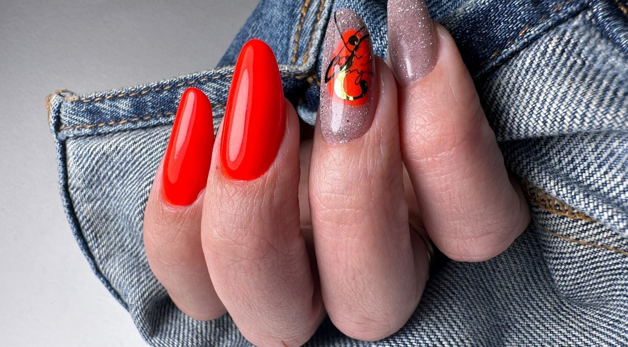 Bright nail art with glossy red and glitter designs at Nails by Amber, Heywood, England, GB.