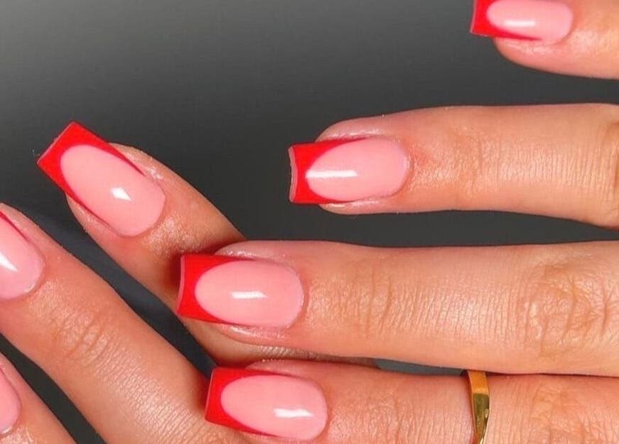 Close-up of French manicure with red tips by Nails by Amber in Heywood, England, GB.