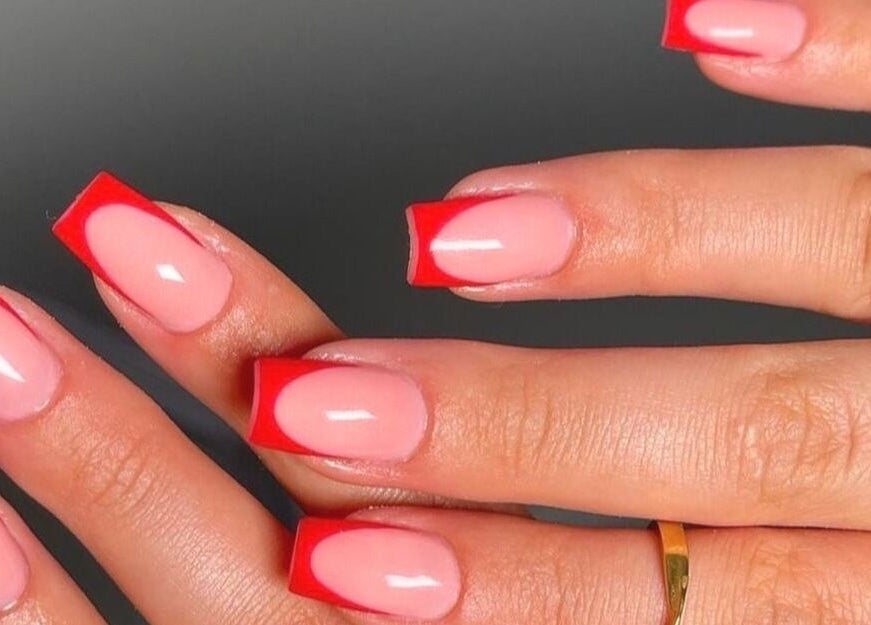 Close-up of French manicure with red tips by Nails by Amber in Heywood, England, GB.