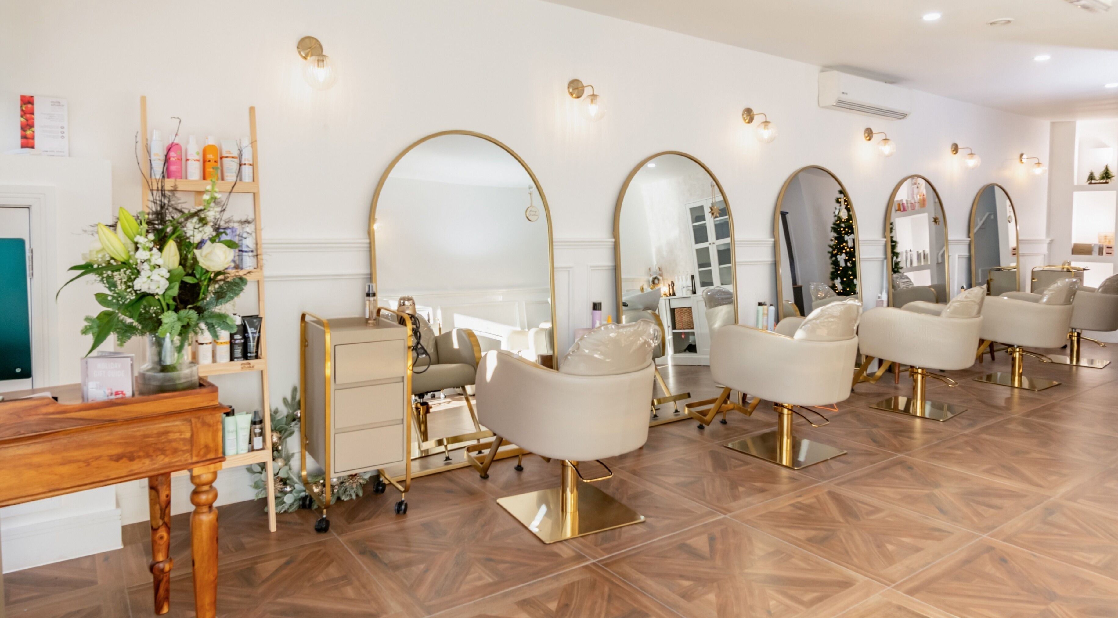 Chic interior of VOIE Hair Preston, Preston, England, GB with stylish chairs and mirrors.