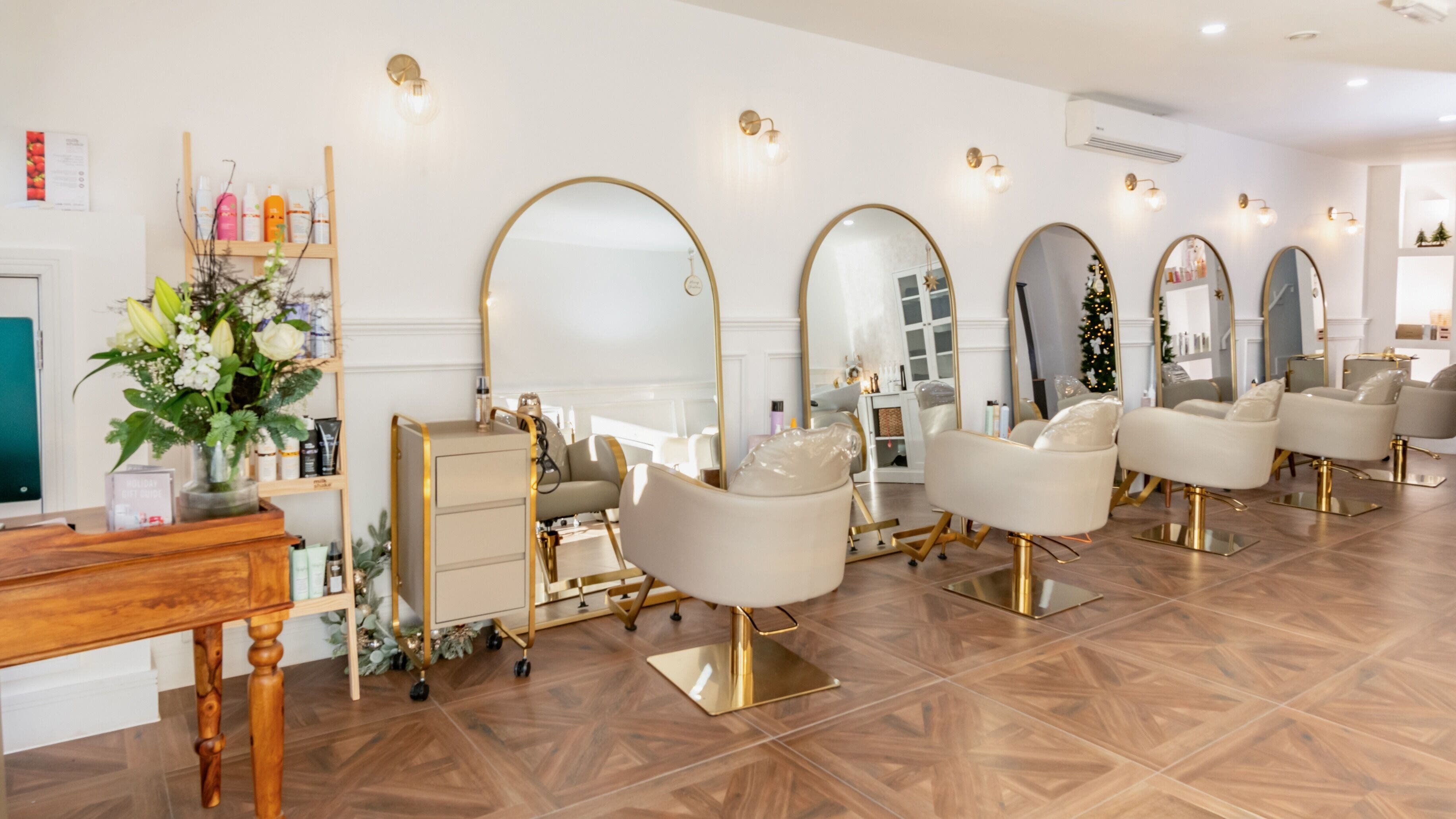 Chic interior of VOIE Hair Preston, Preston, England, GB with stylish chairs and mirrors.