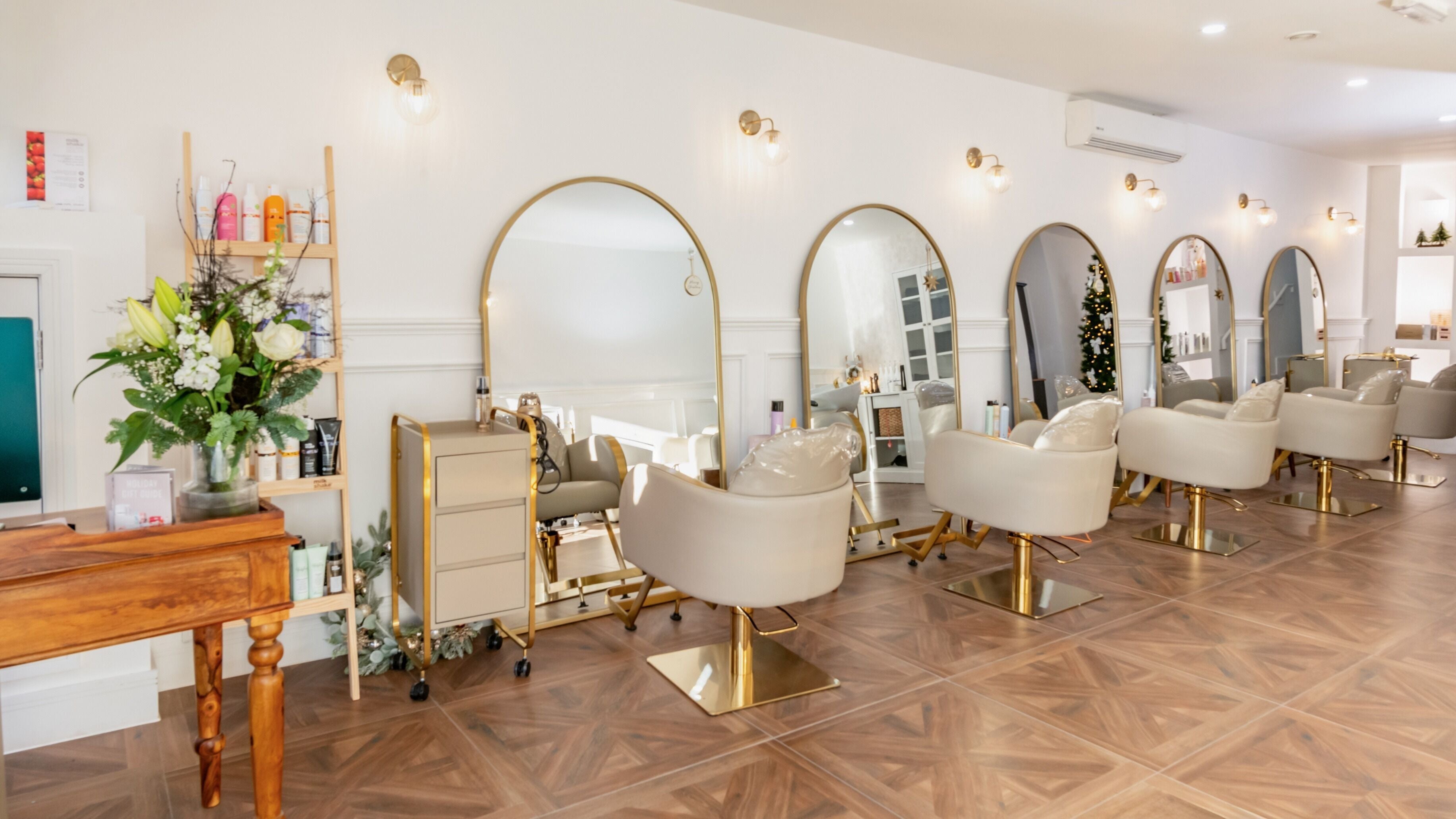 Chic interior of VOIE Hair Preston, Preston, England, GB with stylish chairs and mirrors.
