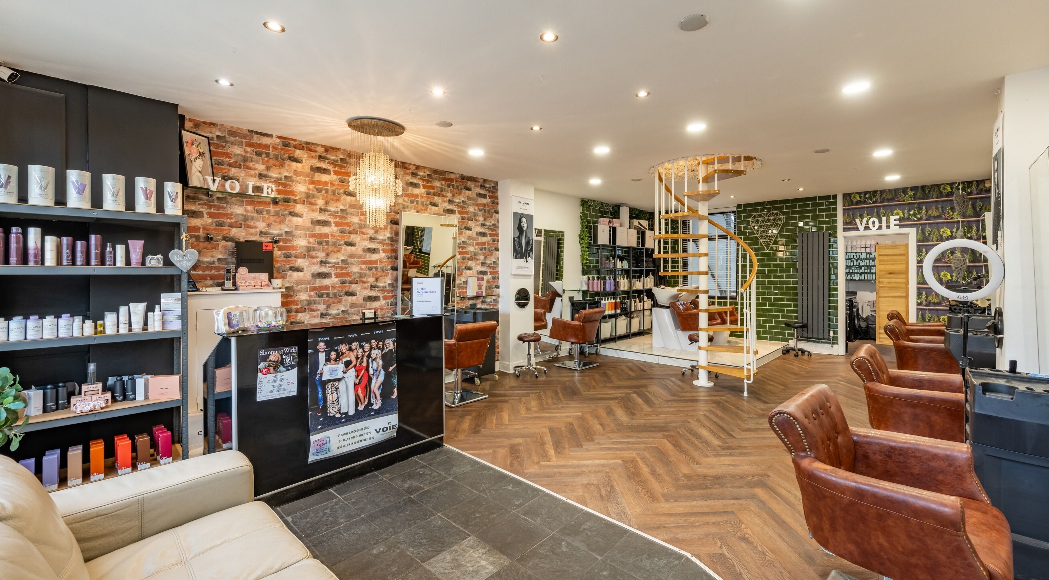 Interior of VOIE Hair Leyland showcasing stylish chairs and decor in Leyland, England, GB.