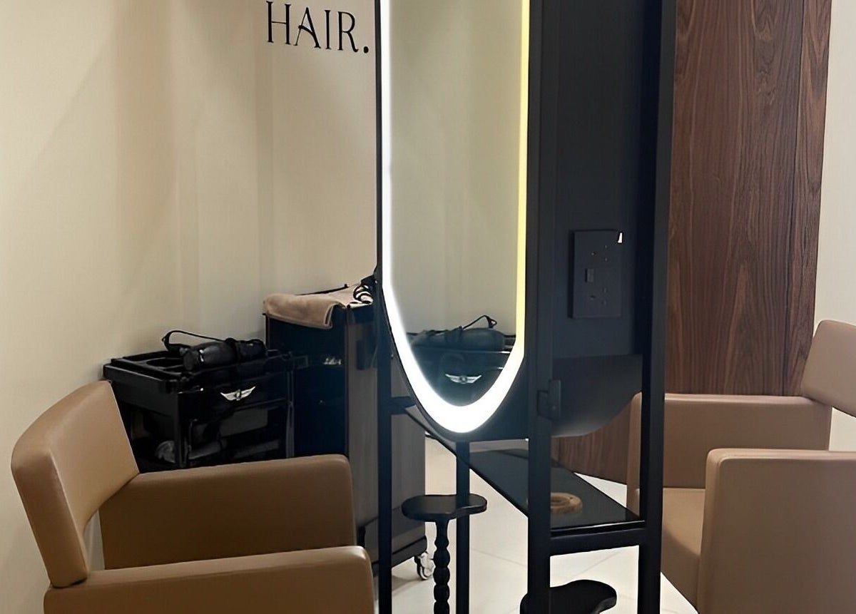 Elegant hair styling area with chairs and mirror at Oak Spa, Sharjah, Sharjah, AE.