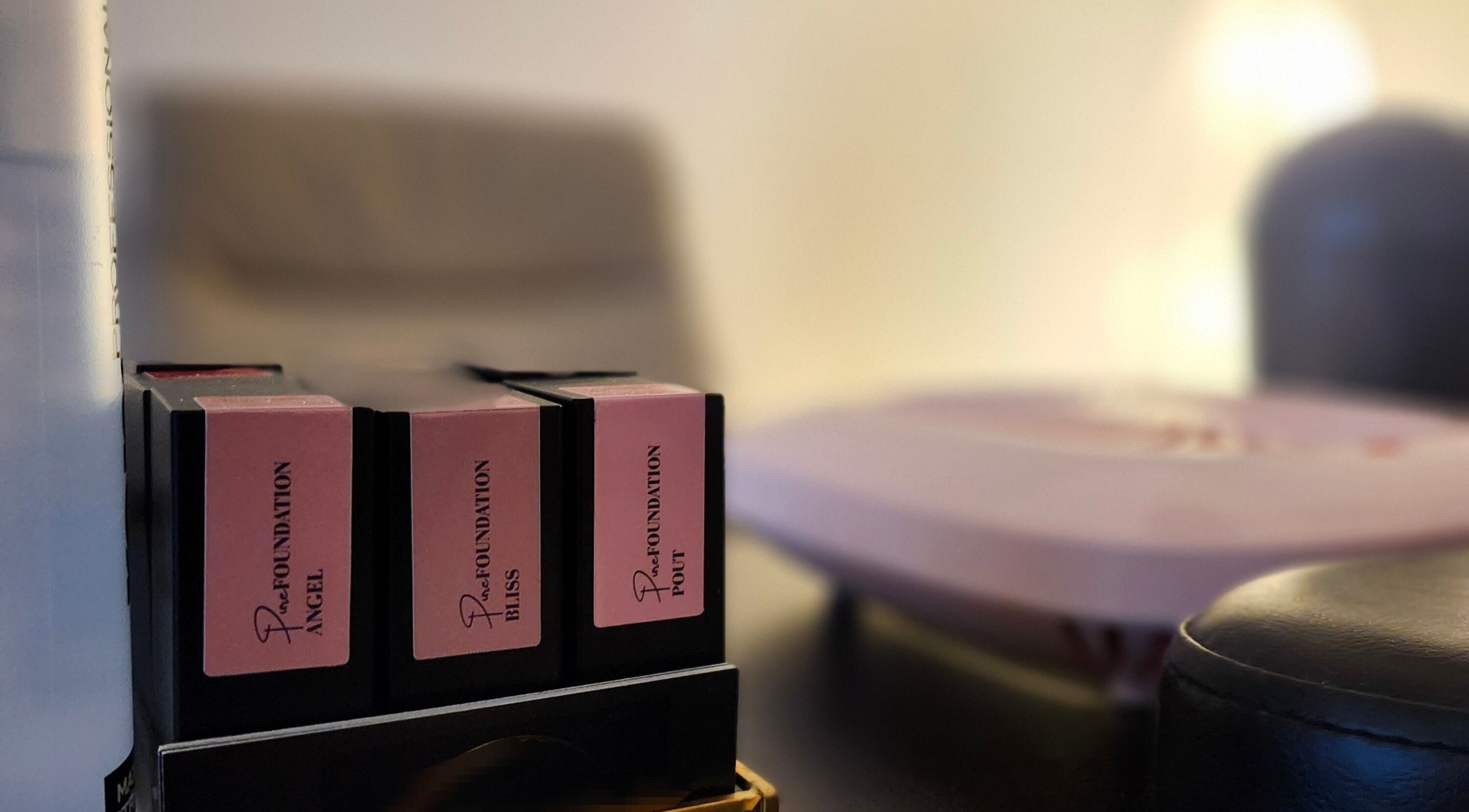 Close-up of beauty products at Lin's Nails Studio, Laval, Québec, CA, showcasing professional foundation range.