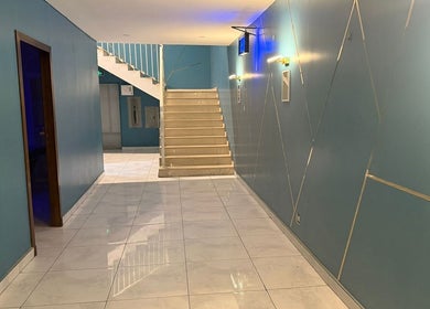 Elegant stairway at AK SPA, Al Hofuf, Eastern Province, SA with modern blue walls.