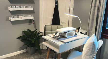 Modern nail station at The Nail Spot, Peebles, Scotland, GB with elegant decor and ample lighting.