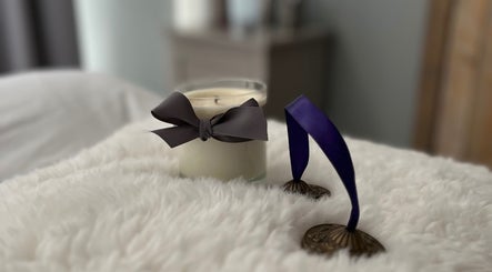 Relaxing candle and chimes at The Tranquility Skin Barn, Swainsthorpe, England, GB, enhancing the soothing ambiance.