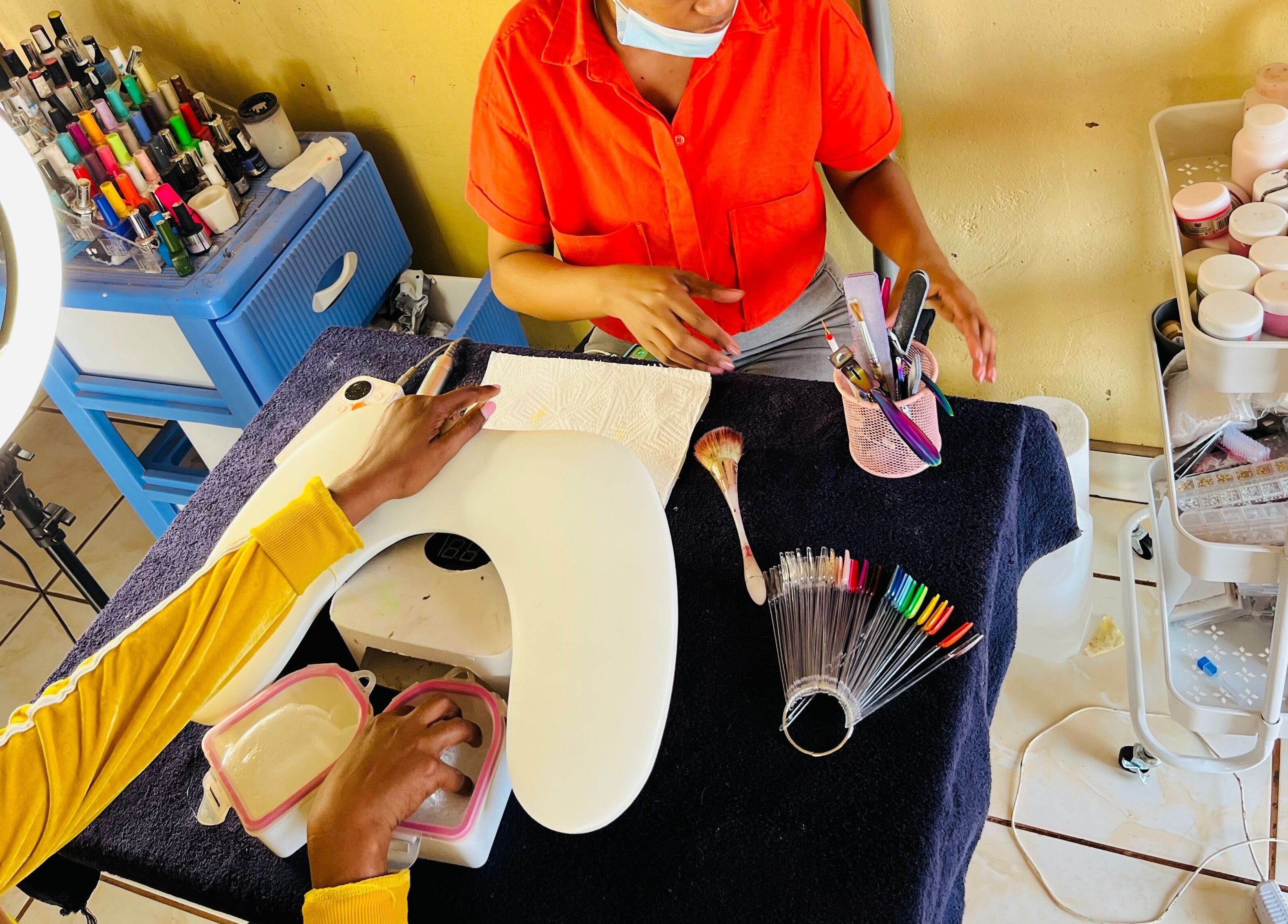 Nail technician at Funky Nails By Sholo in Kuruman, South Africa, ZA, creating exquisite nail designs.