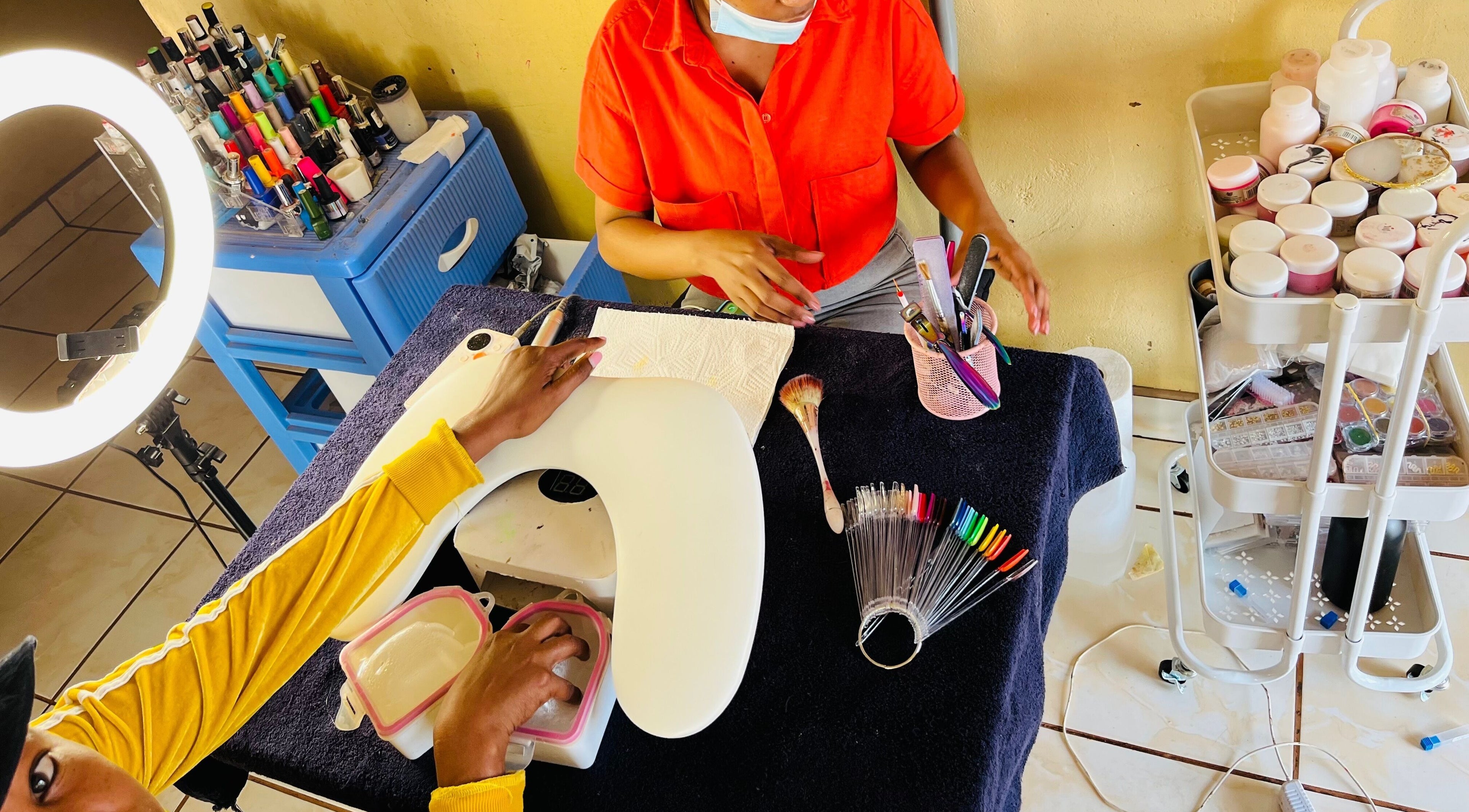 Nail technician at Funky Nails By Sholo in Kuruman, South Africa, ZA, creating exquisite nail designs.