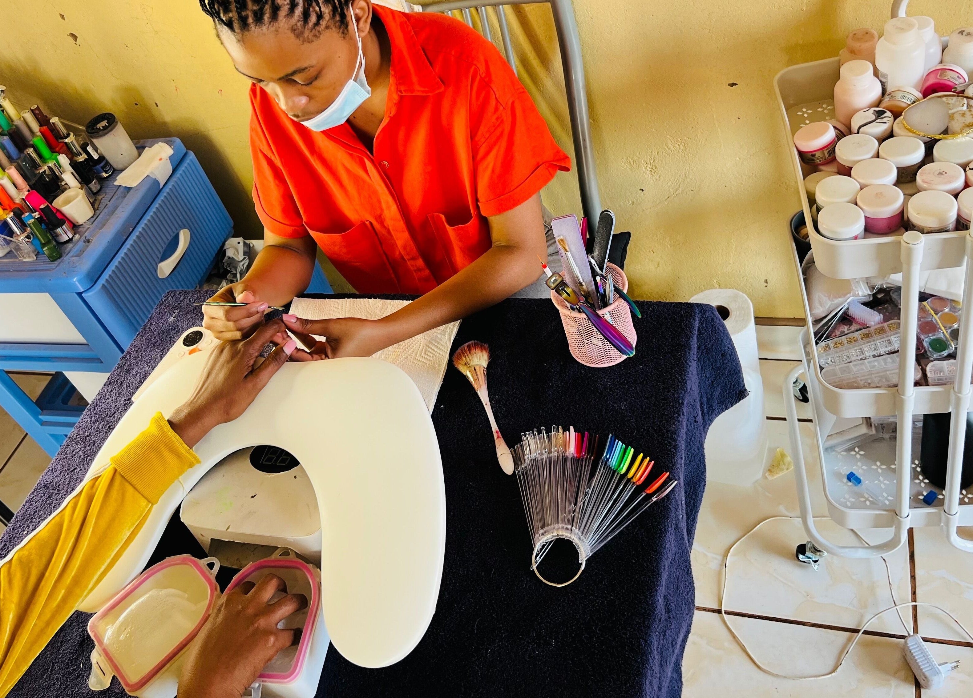 Nail artist at Funky Nails By Sholo in Kuruman, South Africa, ZA crafting vibrant nails.