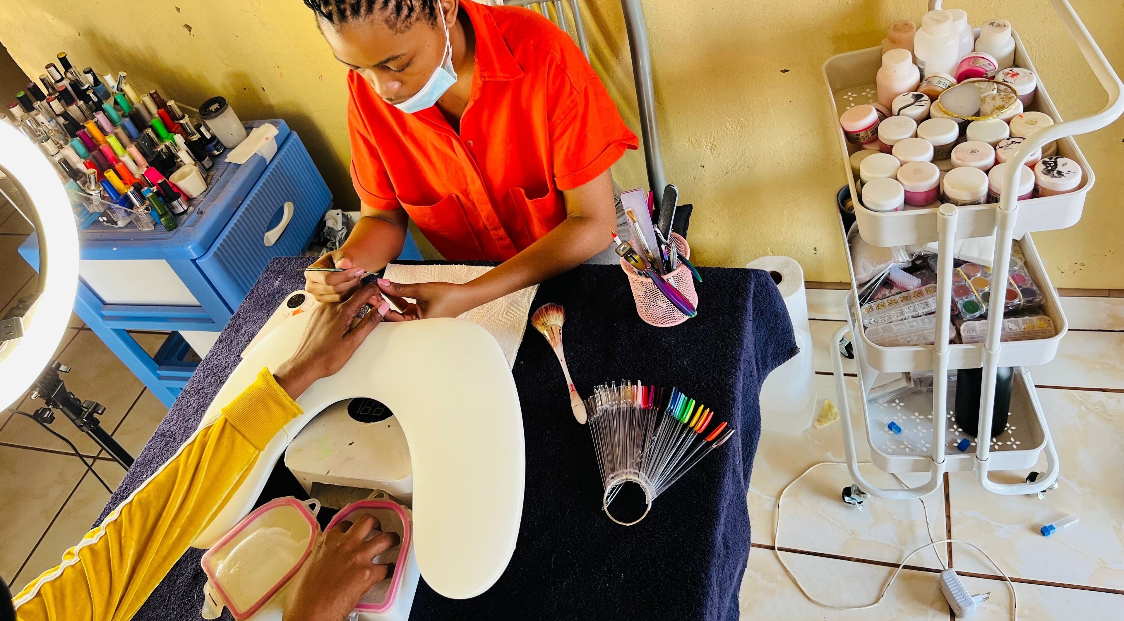 Nail artist at Funky Nails By Sholo in Kuruman, South Africa, ZA crafting vibrant nails.