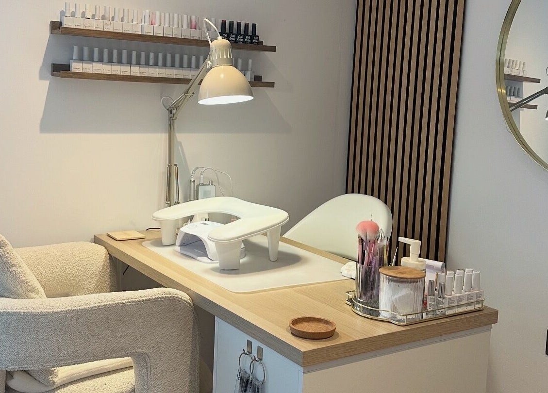 Modern manicure station at The Nail Studio - By Beth Rudd, York, England, GB with elegant decor and nail polish display.