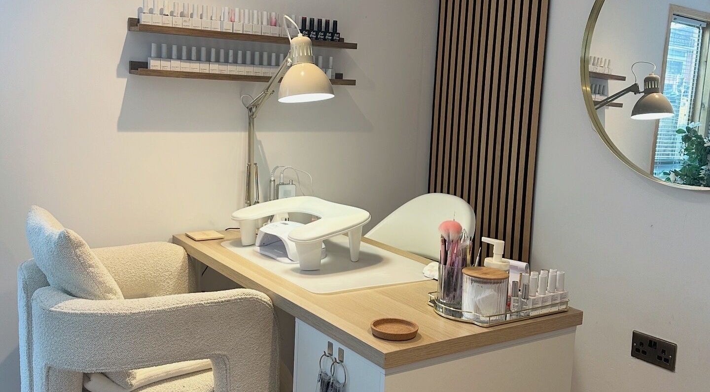 Modern manicure station at The Nail Studio - By Beth Rudd, York, England, GB with elegant decor and nail polish display.