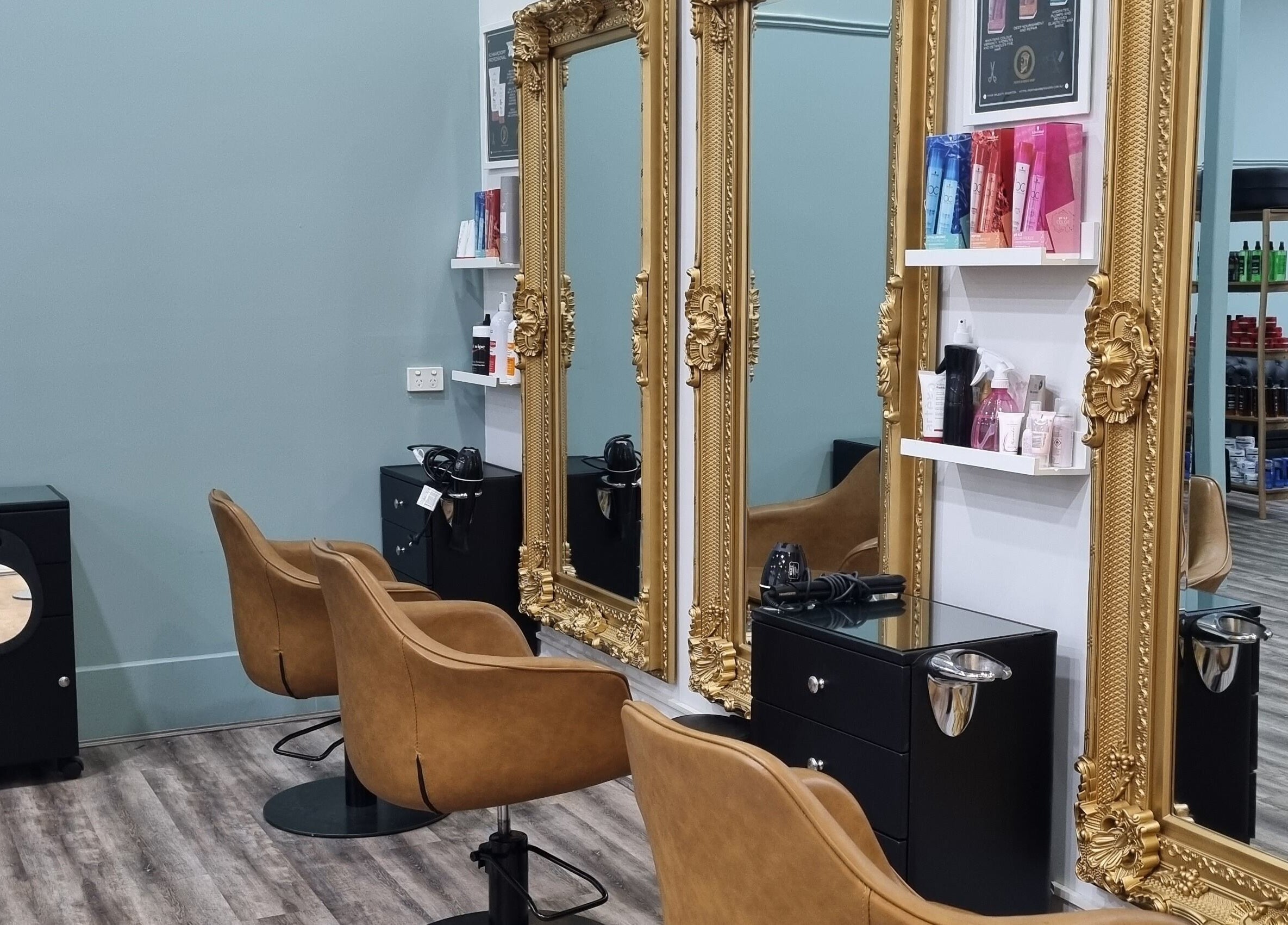 Elegant hair styling stations with gold frames at Hair Majesty, Riverton, Western Australia, AU.