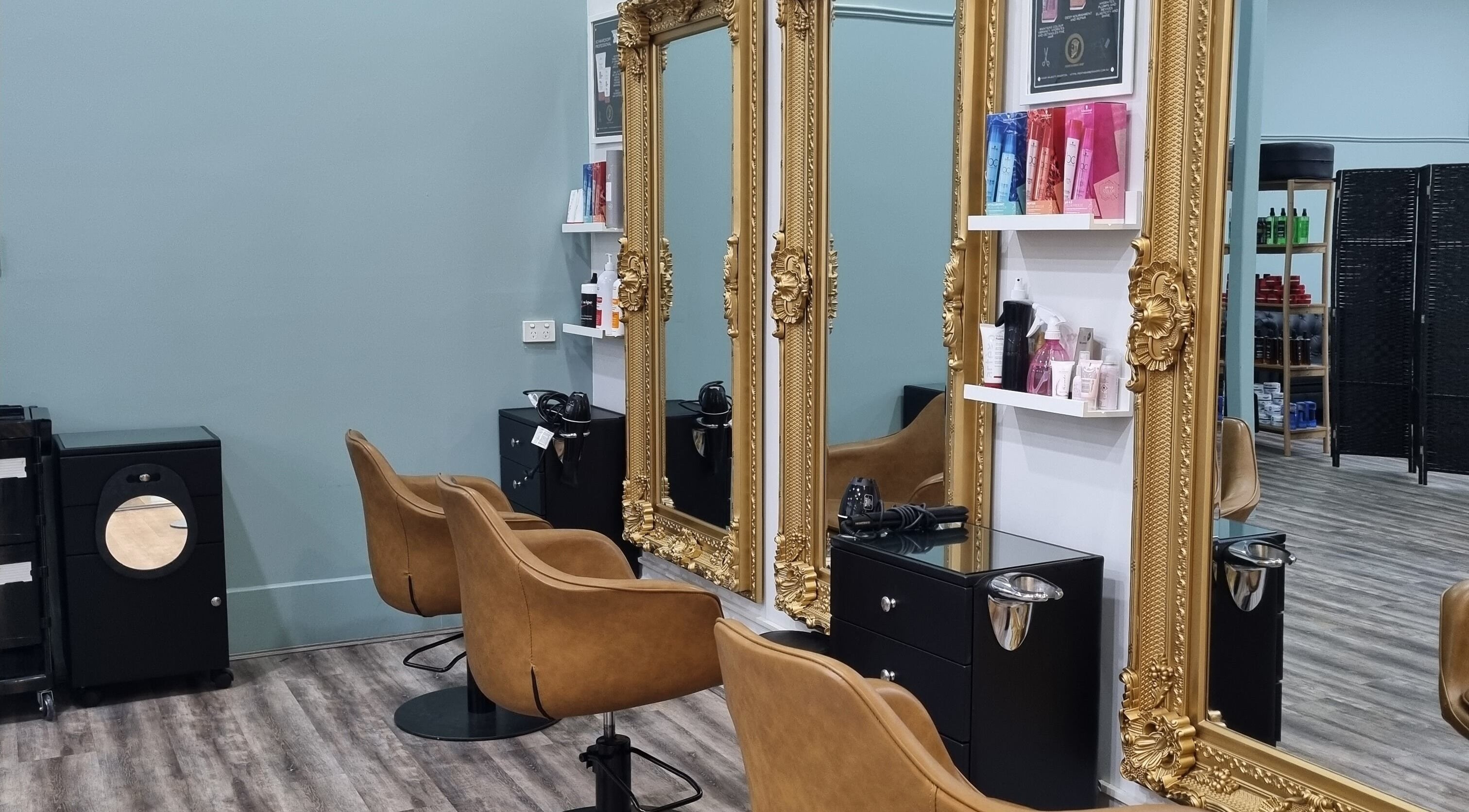Elegant hair styling stations with gold frames at Hair Majesty, Riverton, Western Australia, AU.