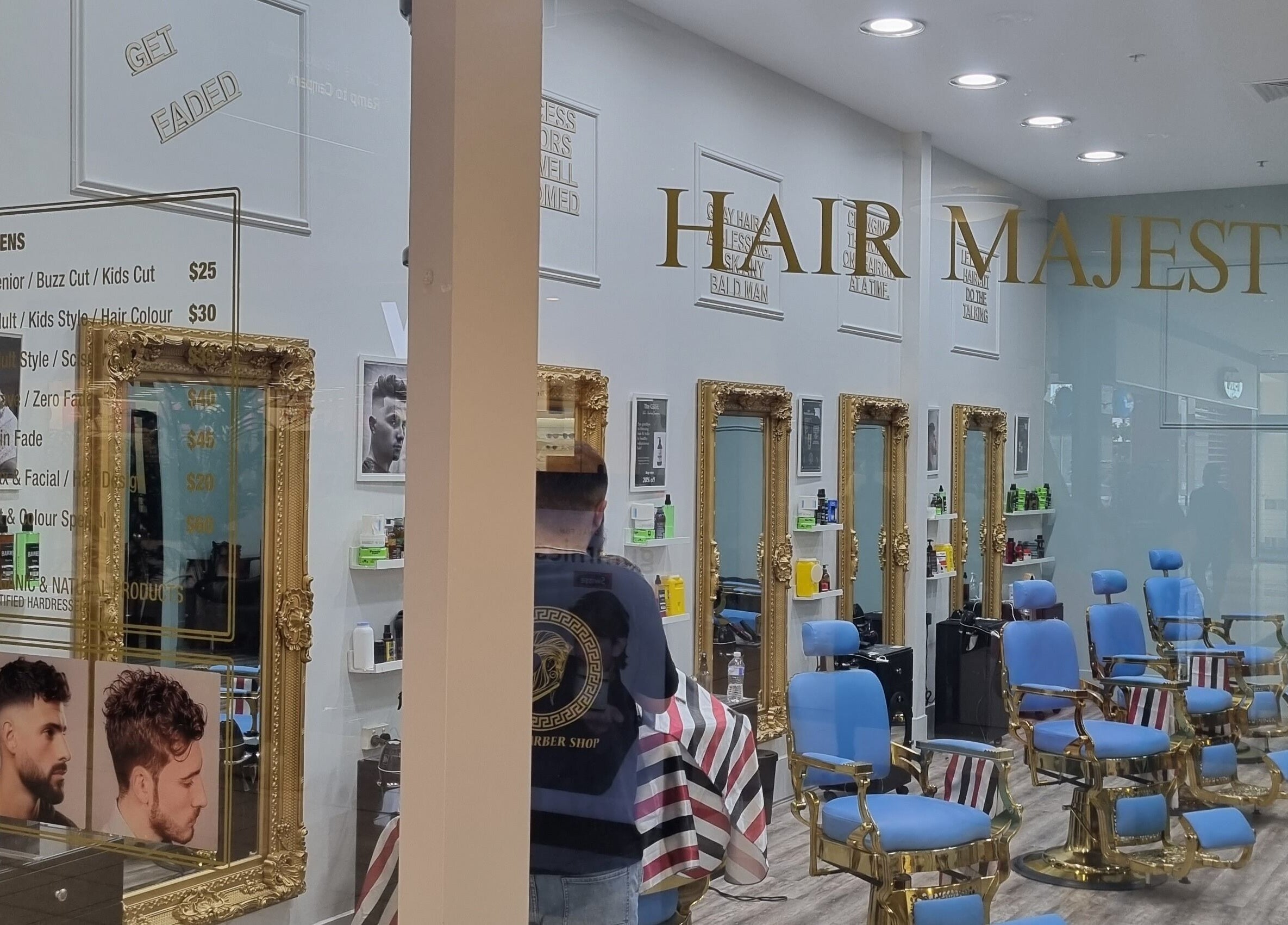Interior view of Hair Majesty salon in Riverton, Western Australia, AU showcasing luxurious seating and mirrors.