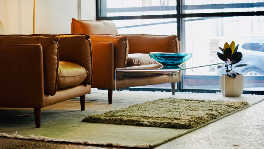 Elegant lounge at Abōde, featuring stylish armchairs and decor in Sydney, New South Wales, AU.