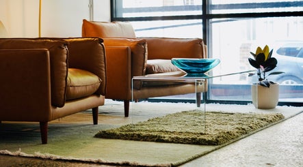 Elegant lounge at Abōde, featuring stylish armchairs and decor in Sydney, New South Wales, AU.