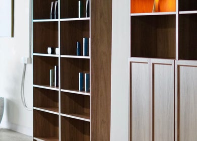Stylish wooden shelves at Abōde, Sydney, New South Wales, AU, showcasing beauty products.
