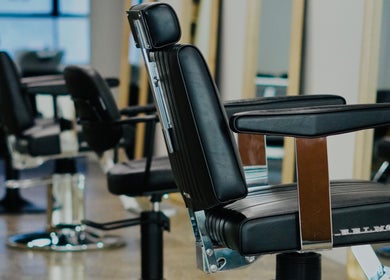 Modern black salon chairs in Abōde at Sydney, New South Wales, AU, offering a stylish setting.