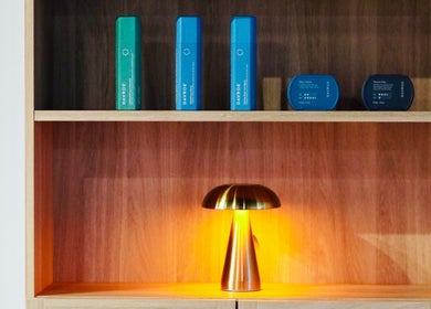 Elegant shelf spotlighting beauty products with a gold lamp at Abōde, Sydney, New South Wales, AU.