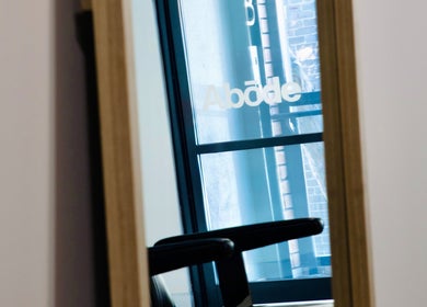 Reflection of Abōde sign on window at beauty venue in Sydney, New South Wales, AU.